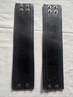 Leather wrist straps with snaps 9”long x 2 1/4” wide